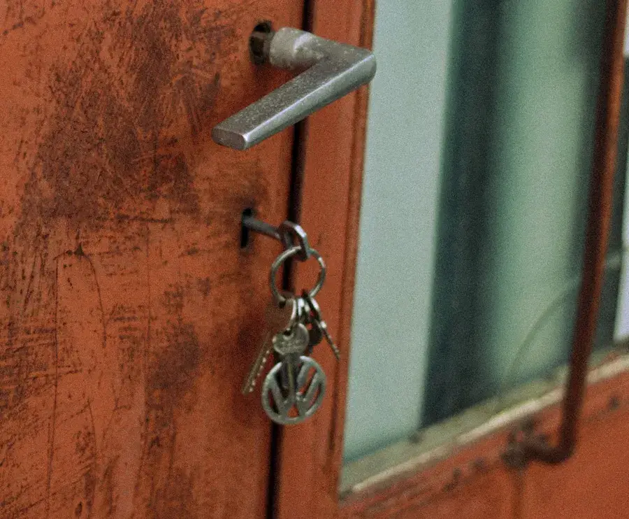 Keys hanging from the lock of an old door – why keys snap and when broken key removal Hucknall is needed, Locksmith Hucknall