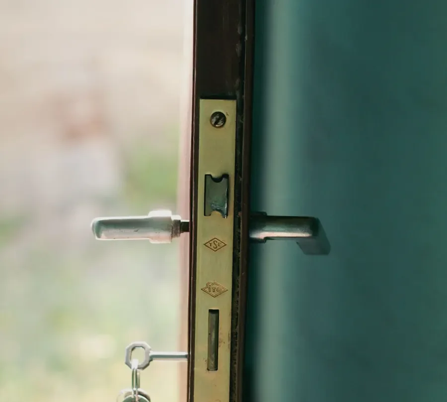 Door edge with a lock faceplate, lever handles and key – checking the multipoint mechanism before you change a uPVC door lock in Hucknall, Locksmith Hucknall guide