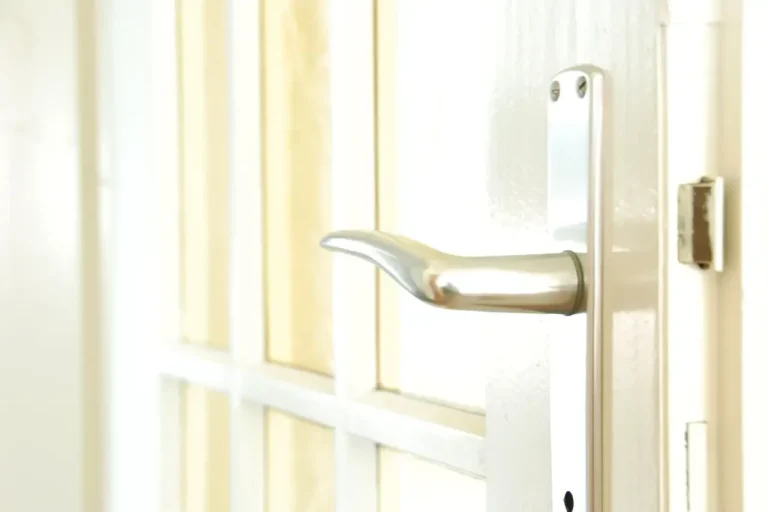 Lock repair or replacement in Hucknall – white door with a lever handle and locking plate, Locksmith Hucknall guide to which your door needs