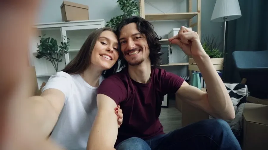 Couple holding up keys in their new home – residential locksmith Hucknall help for homeowners from Locksmith Hucknall