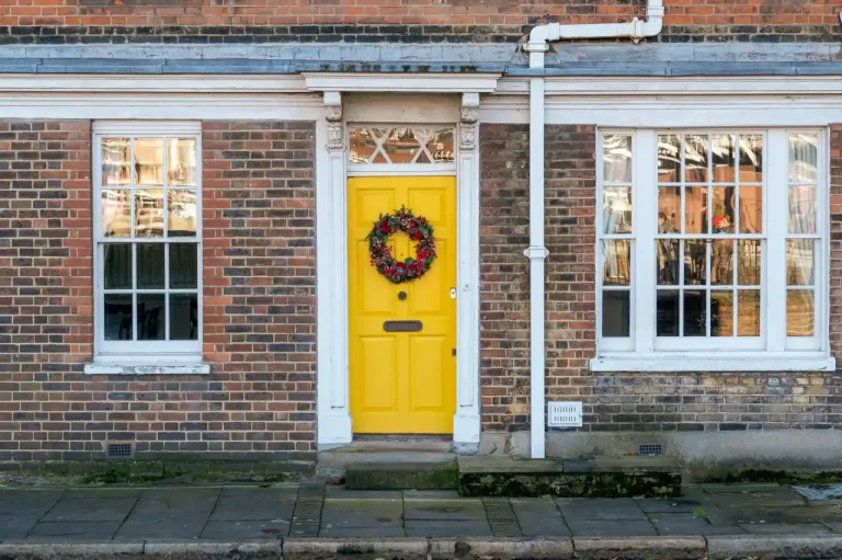 Types of door locks in the UK – yellow front door on a red-brick Victorian house in Hucknall, Locksmith Hucknall guide to identifying your lock